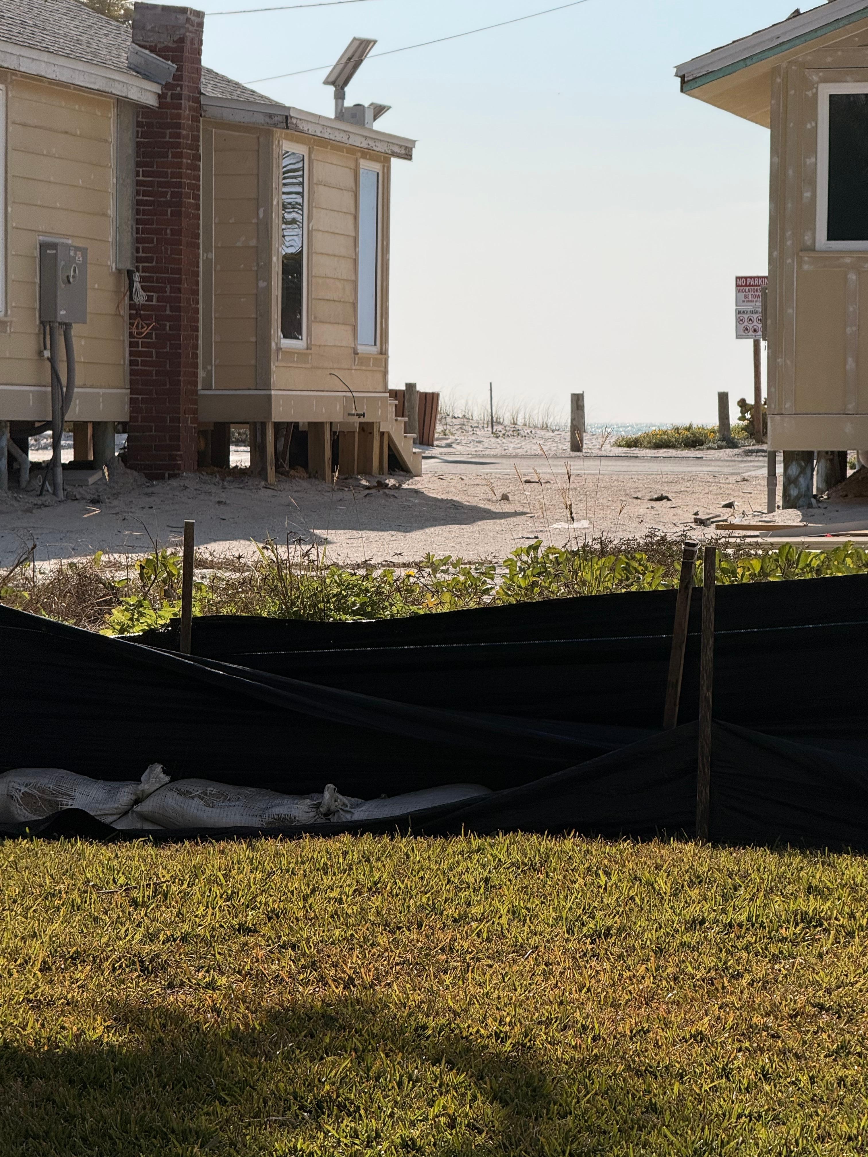 In front of these cabins is a road and then the beach!  Very short walk. 
