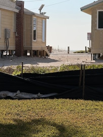 In front of these cabins is a road and then the beach! Very short walk.