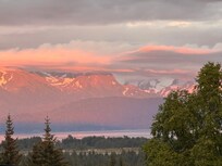Sunset basking the Kenai mountain range - view from the top deck.