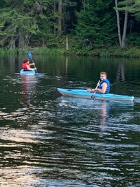 Kayaking with provided kayaks and life jackets.