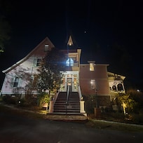 Entrance to the inn at night decorated for the holidays
