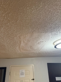 Patched ceiling with no paint or texture.