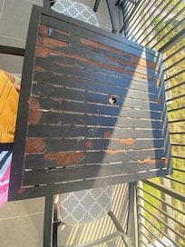 This table is so rusty and old. I should have brought a table cover, so we can enjoy our morning coffee without looking at this ugly table.