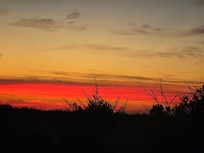 Sunset from gazebo on property.
