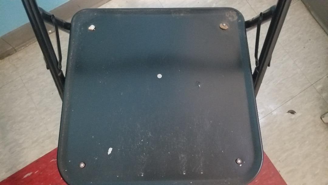 broken chair - not seat with screw heads visible