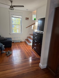 Living room has a couch that turns into a queen size bed