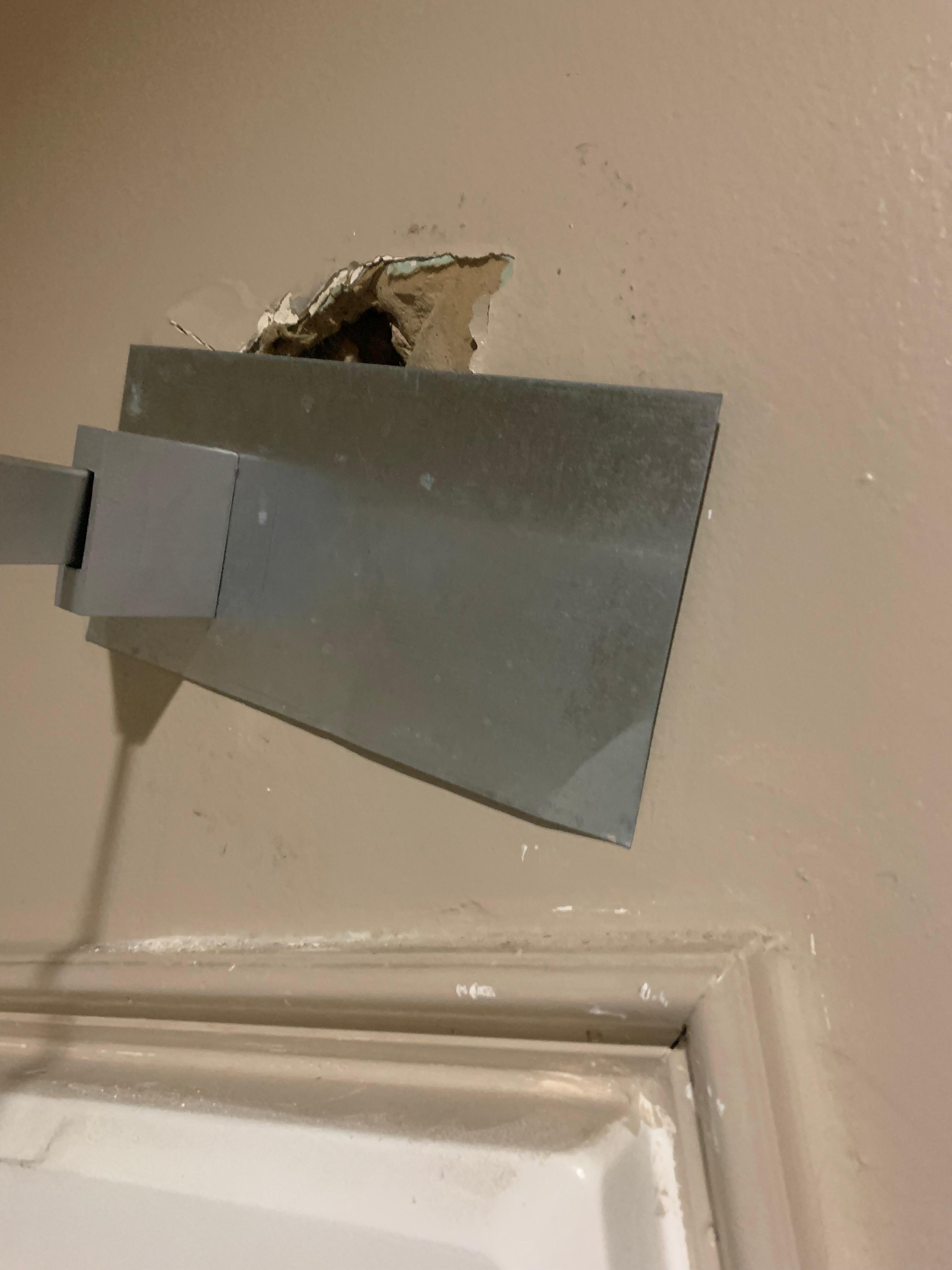 Hole in shower wall