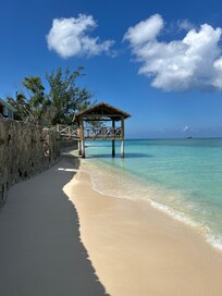 Sea wall path to better beaches. A few minutes walk through the water.