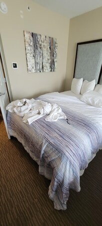 Room had dirty linens on the bed.