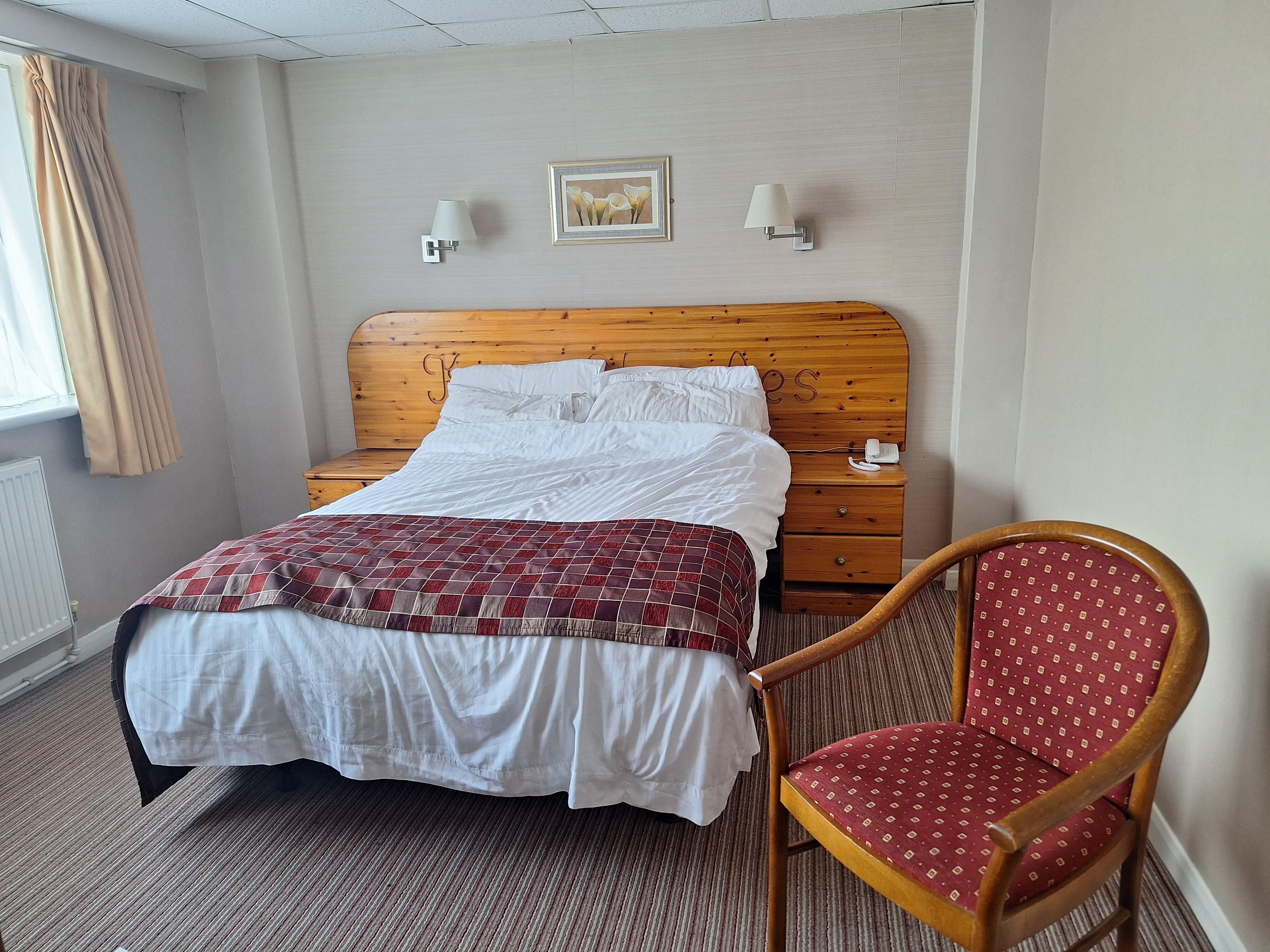 Pine themed bedroom. No air-conditioning, efficient fan provided.