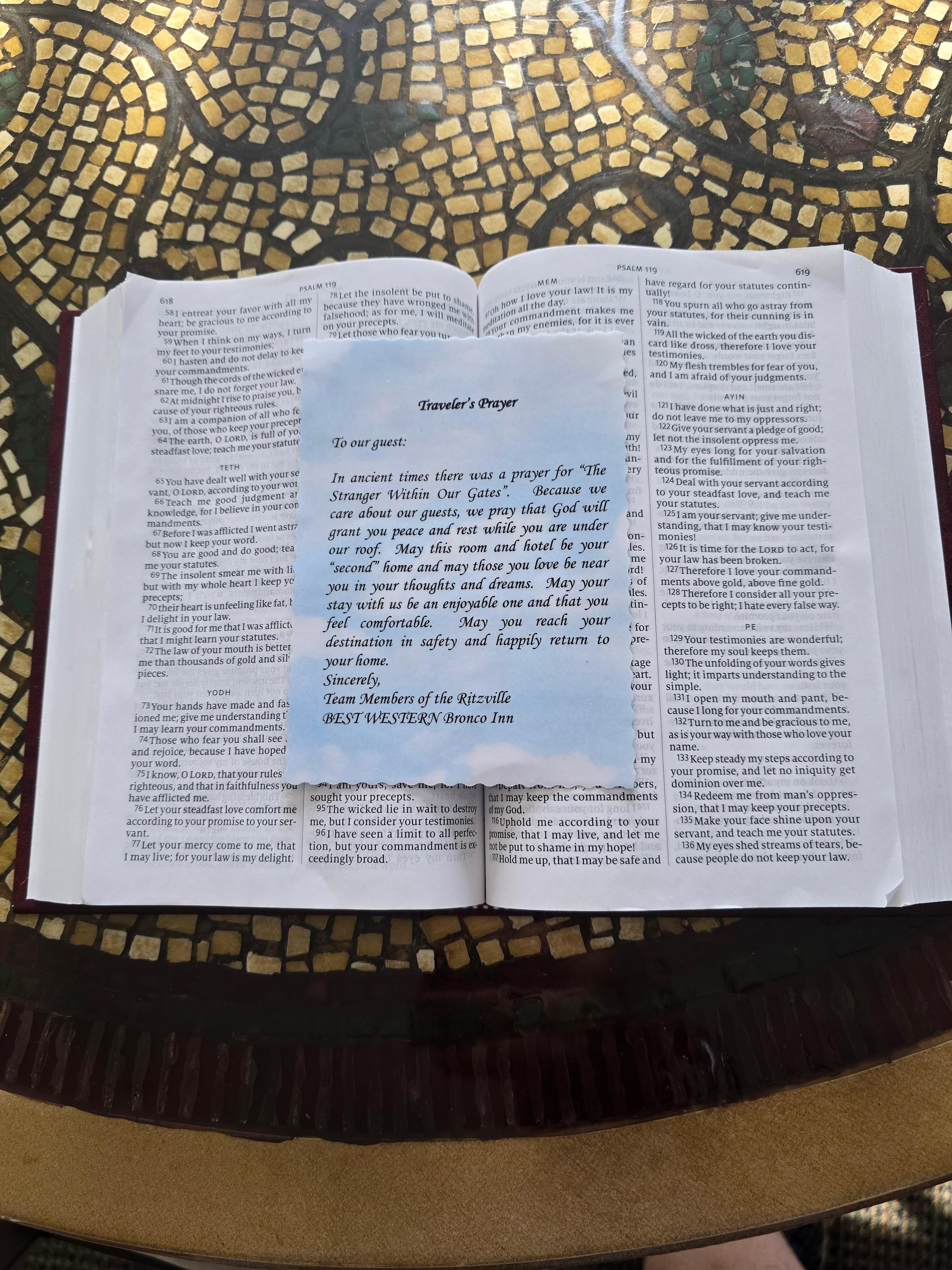 Welcome note, sitting on the Bible 