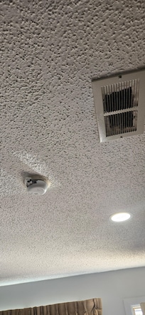 Vent just a hole knocked in ceiling, battery wasn't even in fire detector