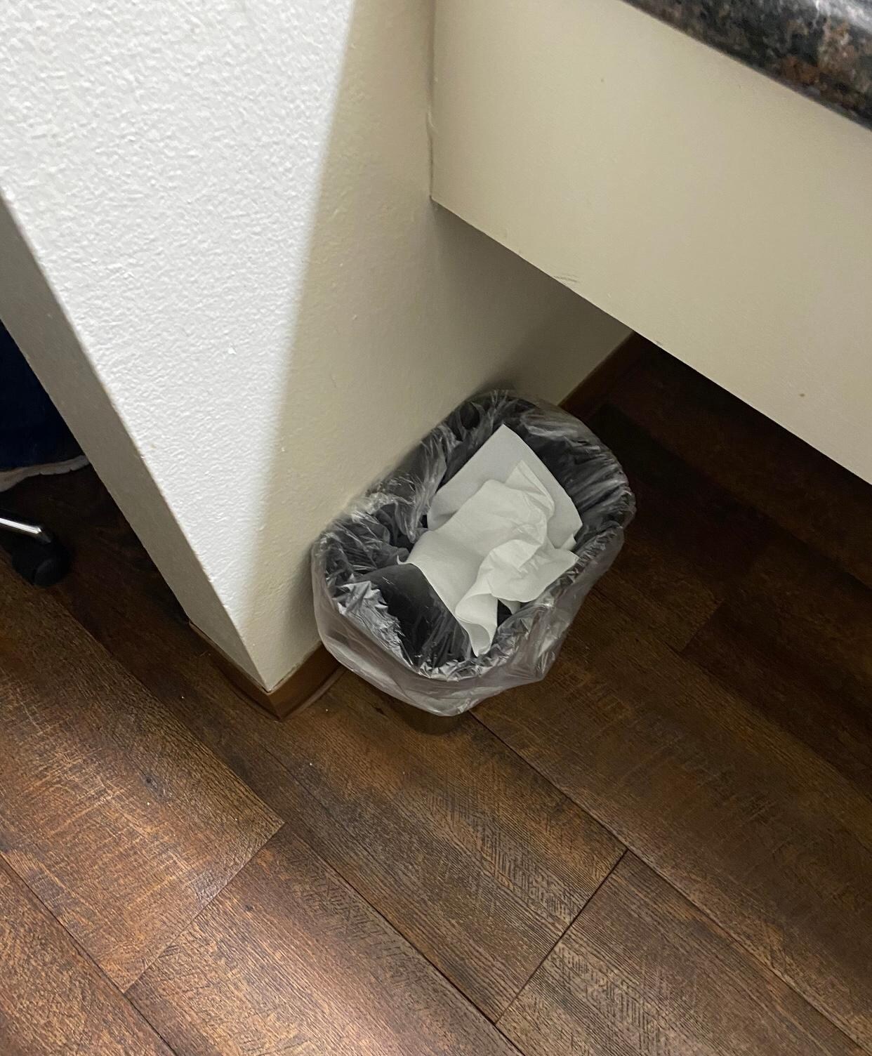 Used tissues / toilet paper in trash 