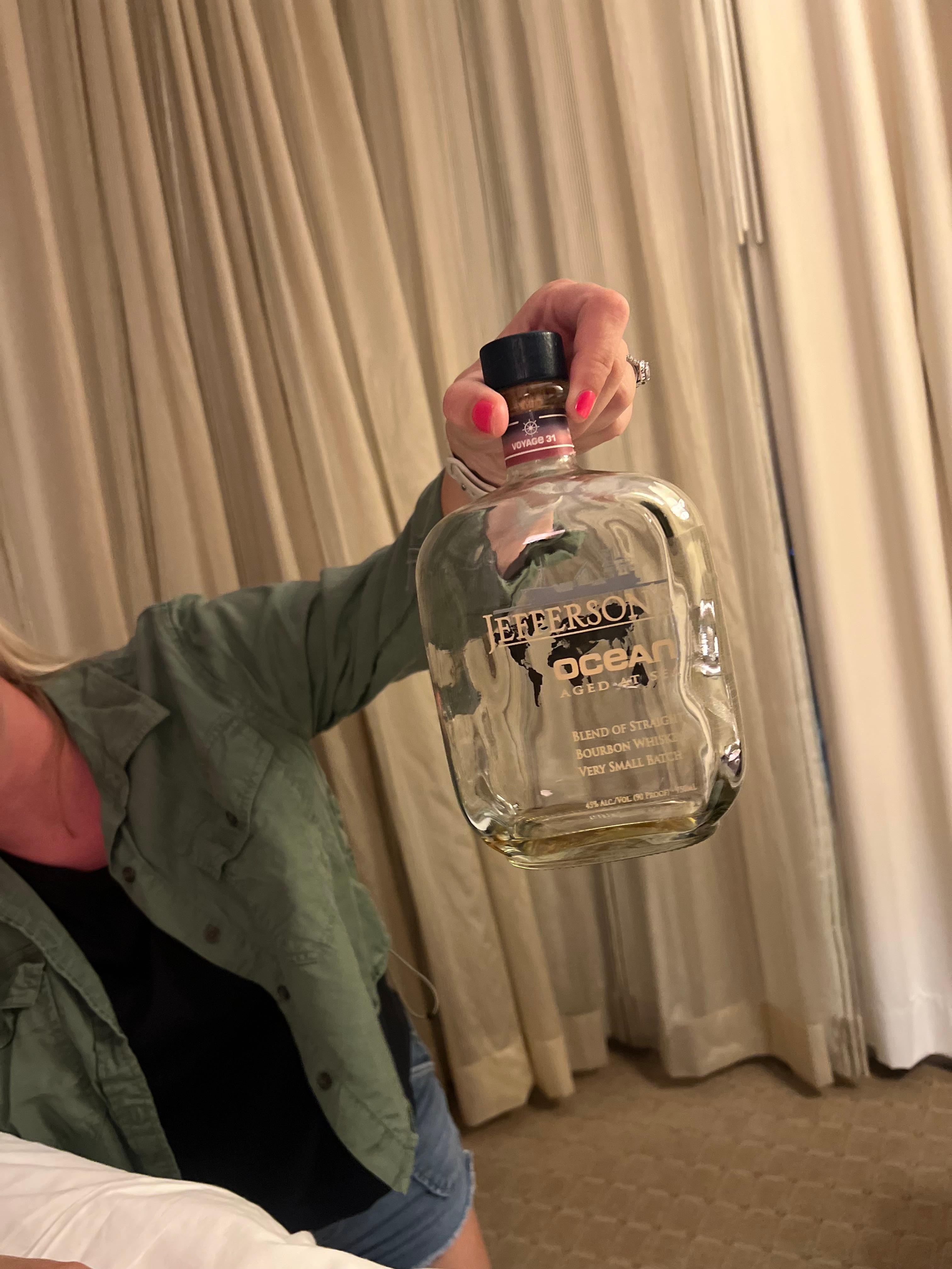 Liquor bottle found under bed