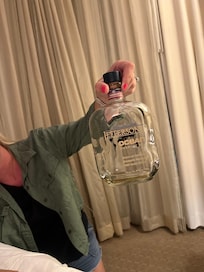 Liquor bottle found under bed