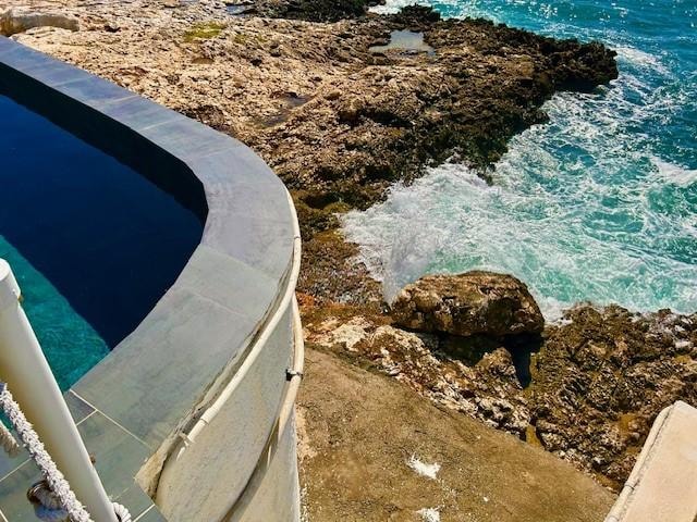View below the pool - active surf resulted is big crashing waves