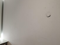 Scuffed wall in the bathroom