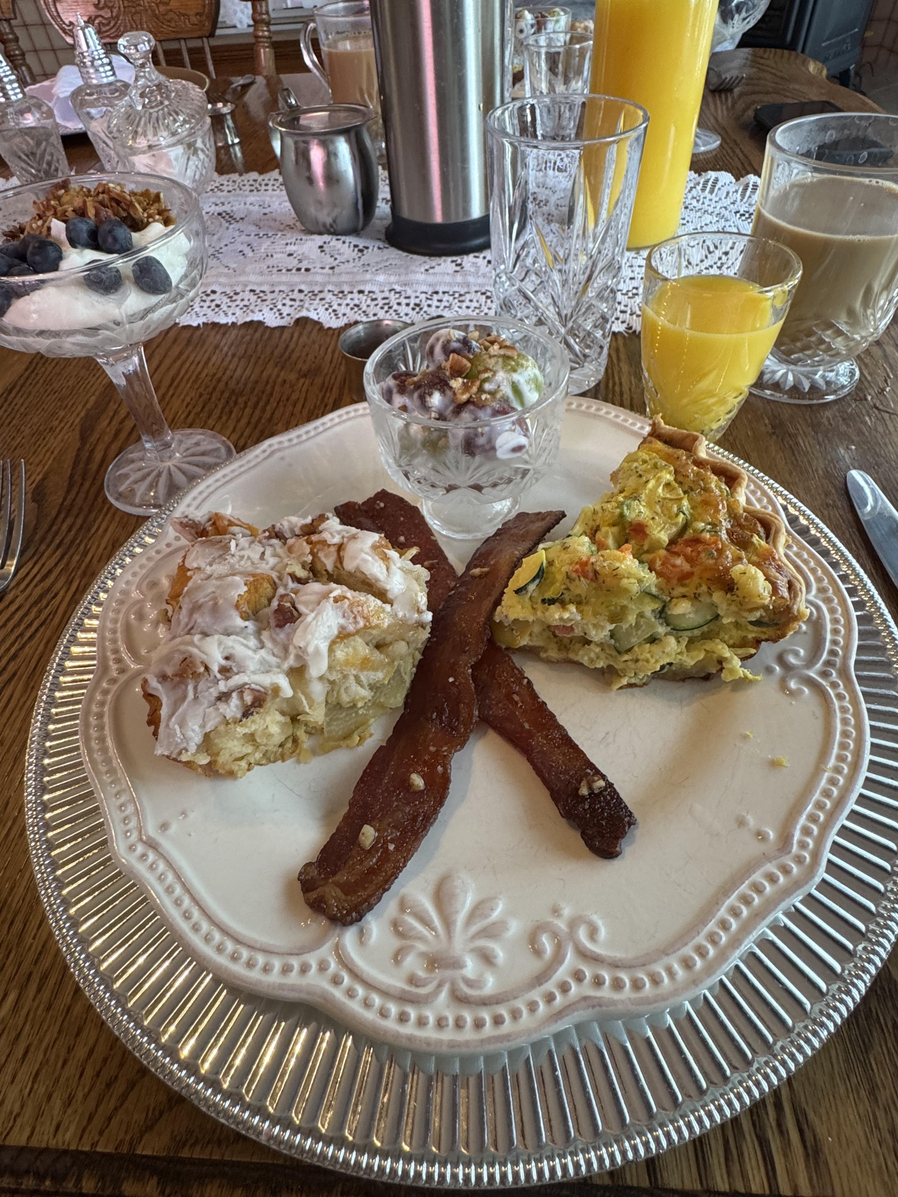 1st breakfast-so good. Bacon, quiche, homemade cinnamon roll, fruit & yogurt parfait