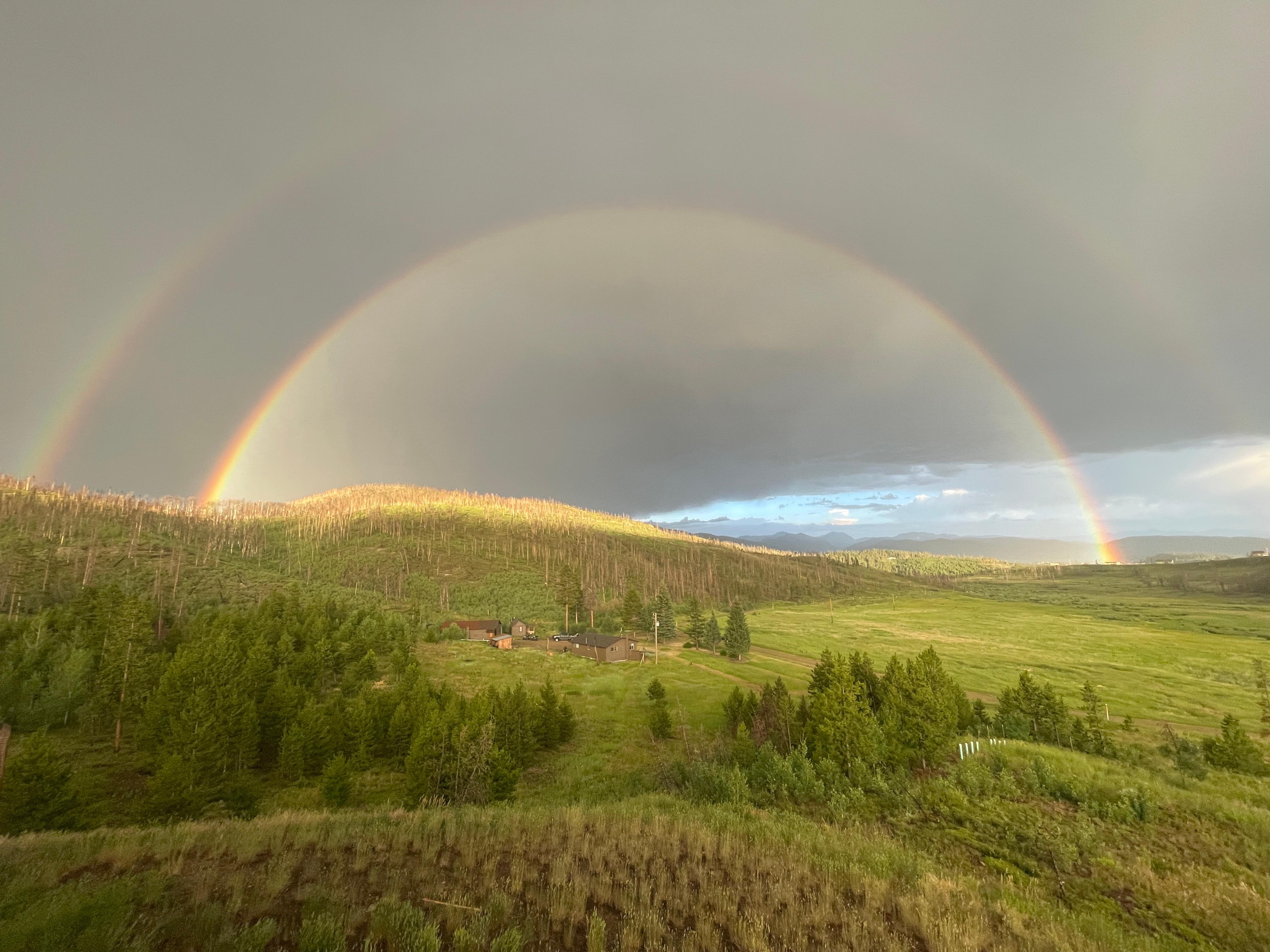 Double rainbow after dramatic storm--taken from front deck of home