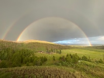 Double rainbow after dramatic storm--taken from front deck of home
