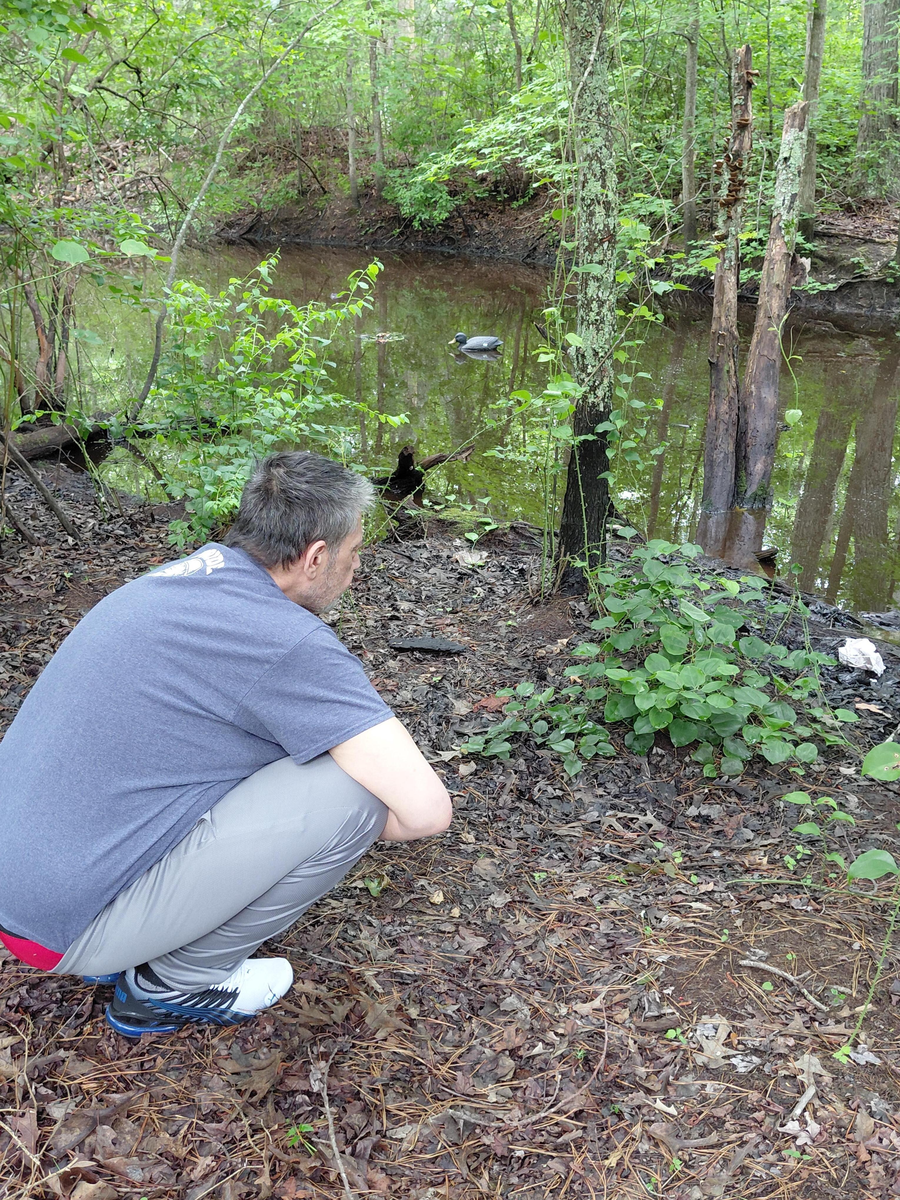 Brian talking to the bullfrog,  Fred 