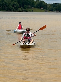 My son in love with River the dog and my youngest daughter enjoying the kayaks.