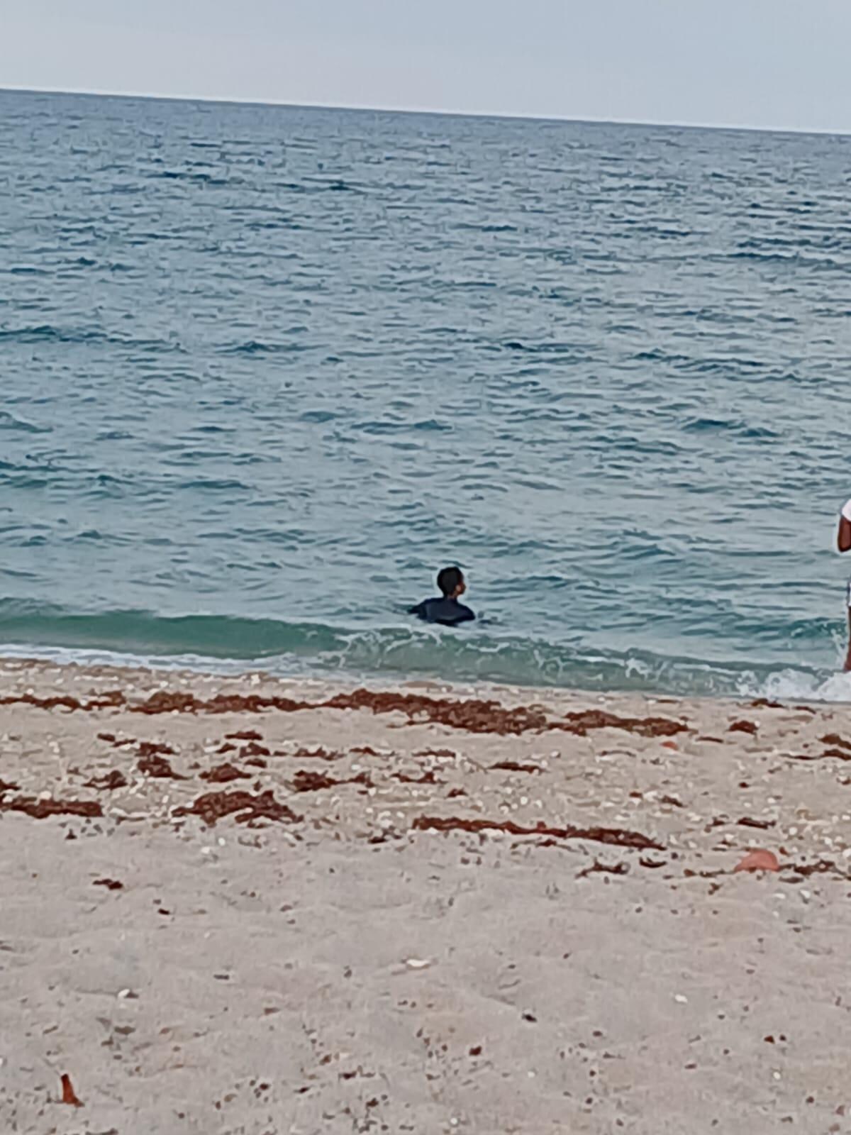 At Riviera Beach with one of the kids during our stay. 