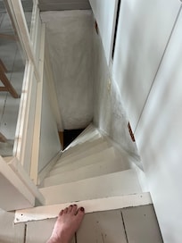 Stairs down to second bedroom.