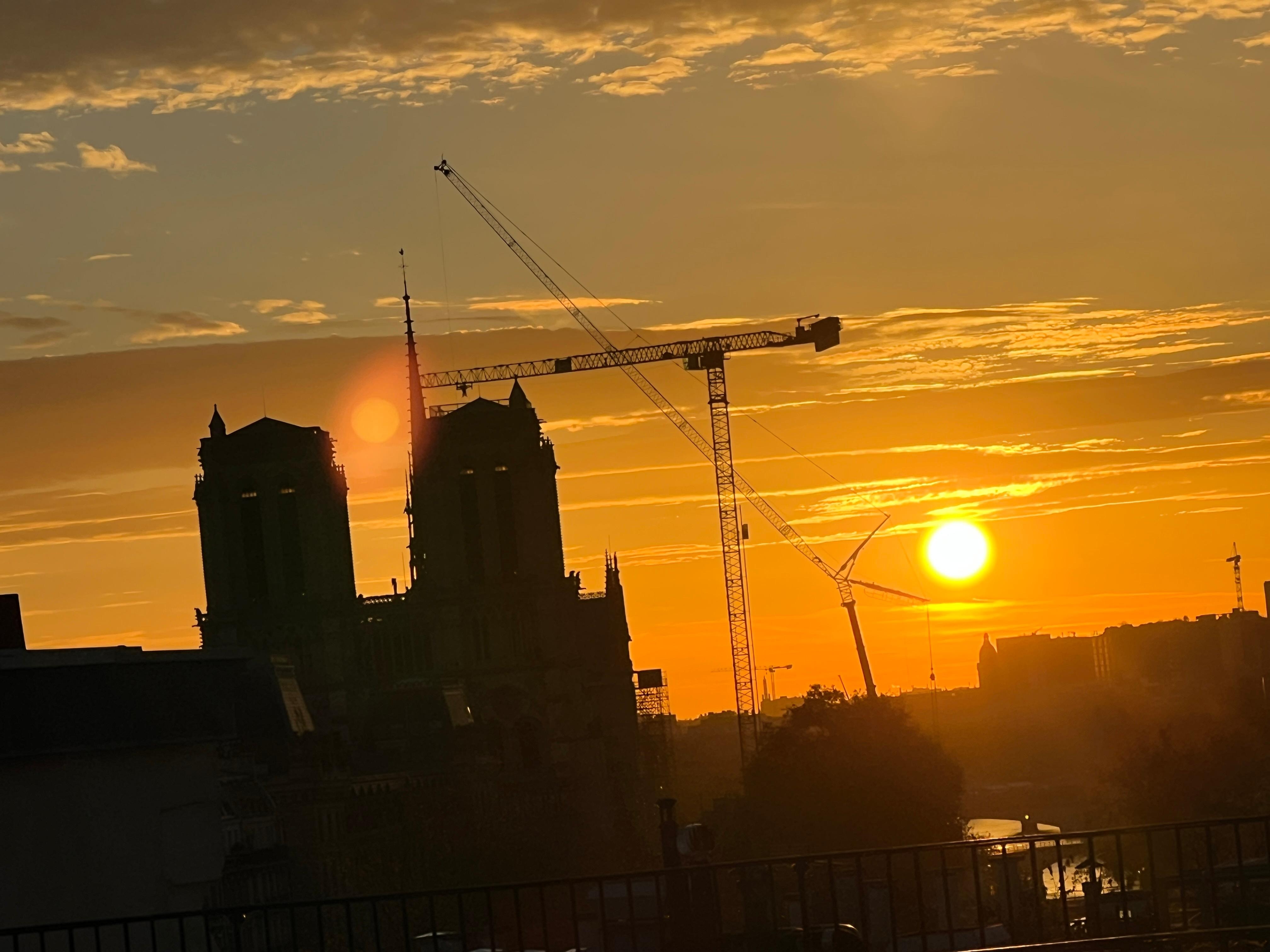 View of sunrise over Notre Dame from room.