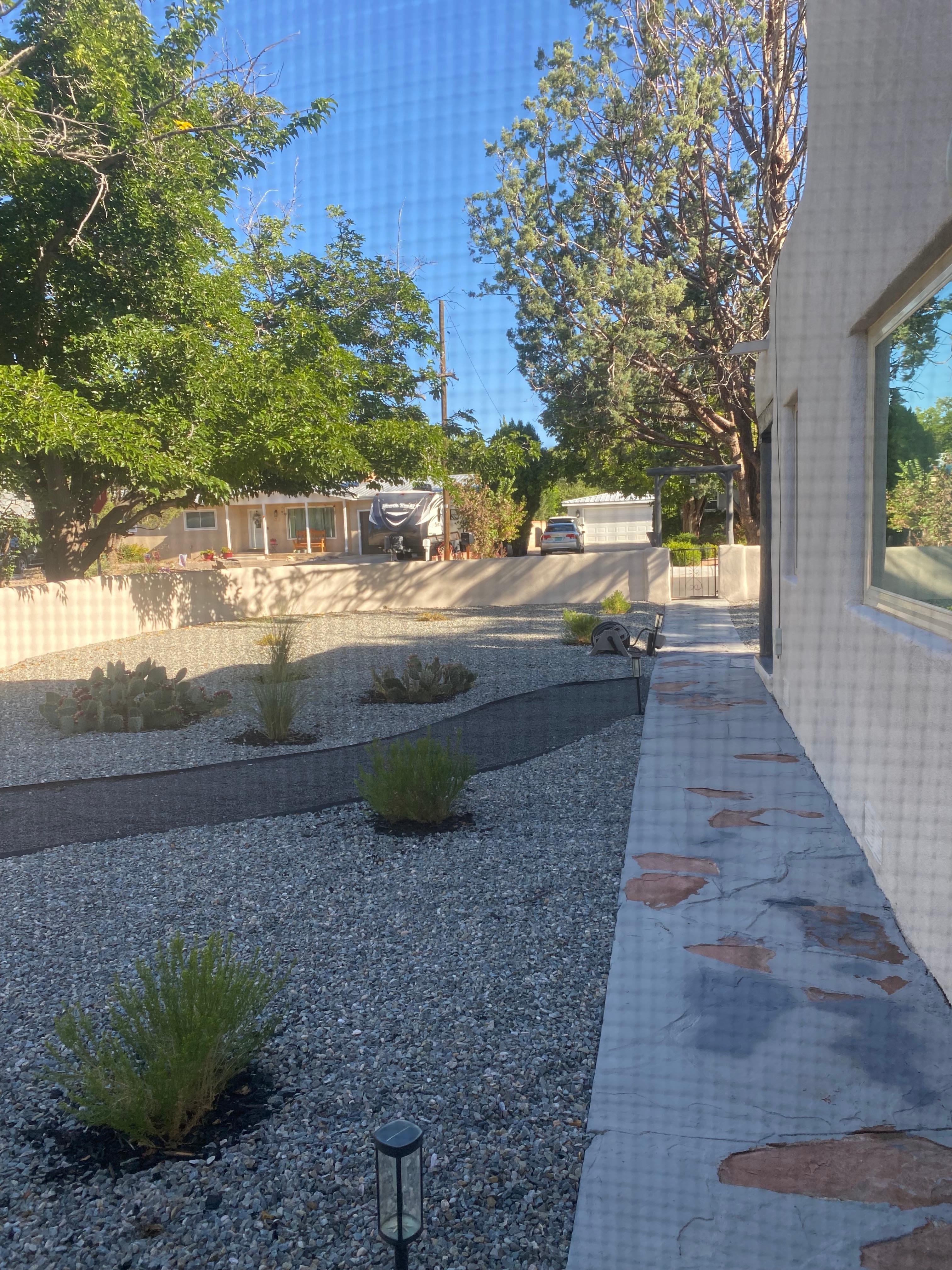 View from the master bedroom of the side front yard.
