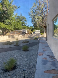 View from the master bedroom of the side front yard.