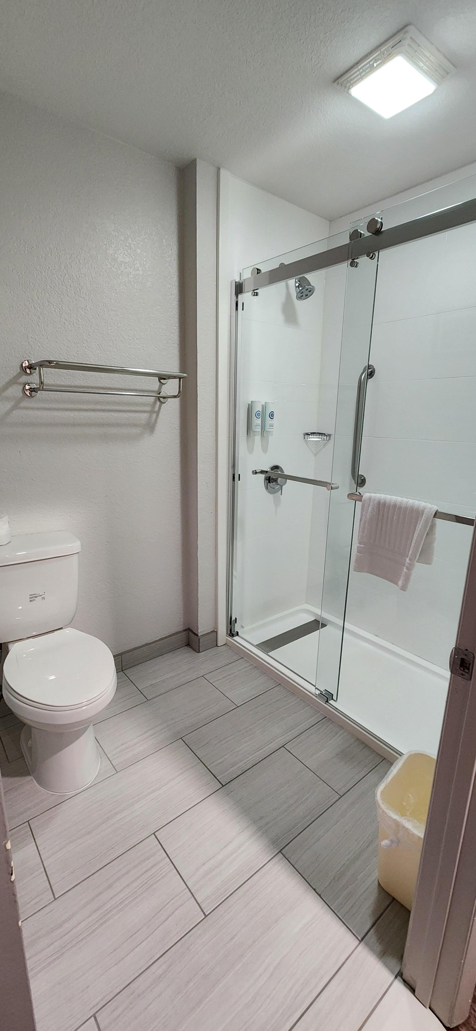 Bathroom with walk-in shower.