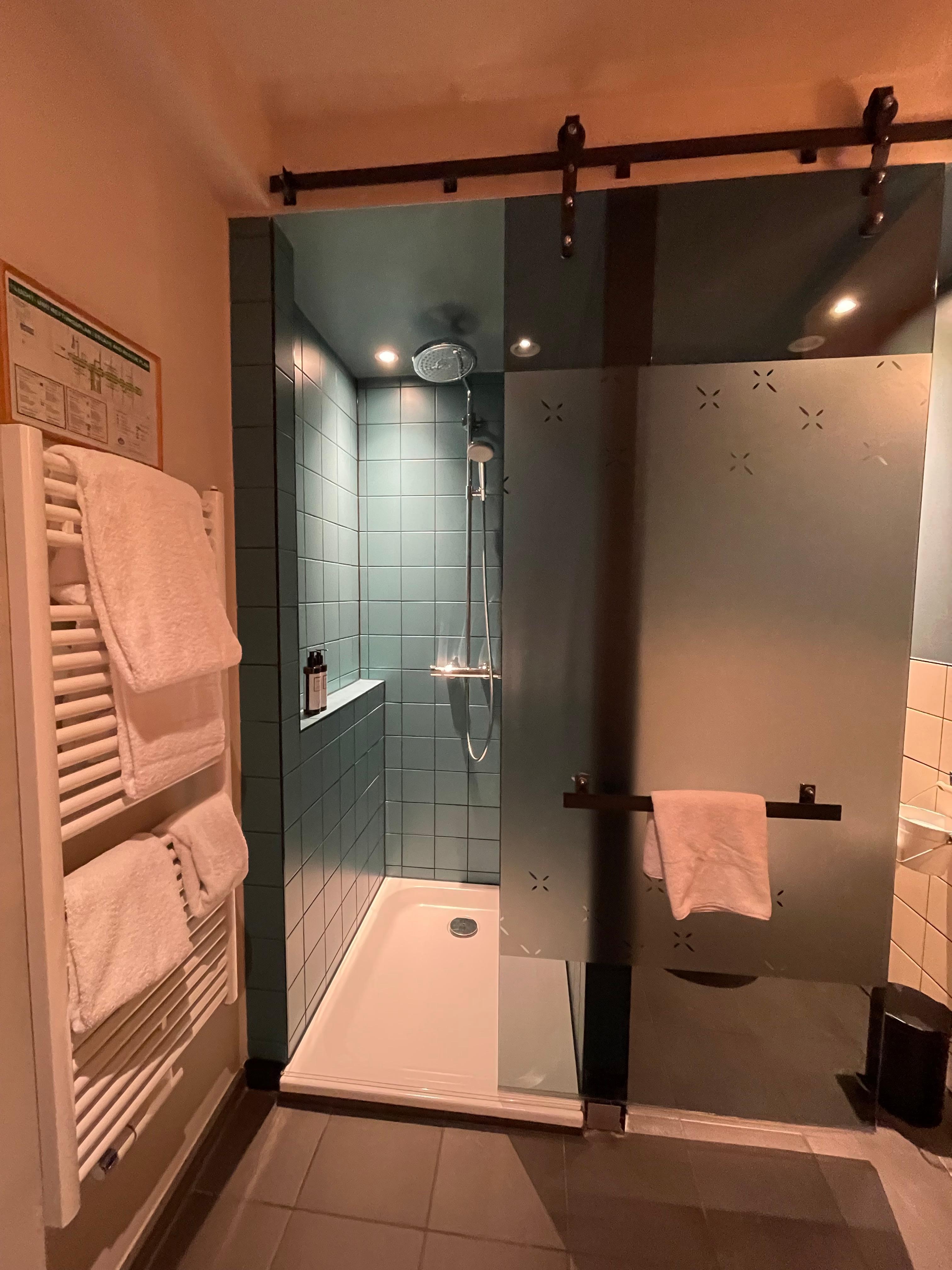 One sliding door between shower and bathroom 