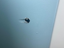 Hole in bathroom wall