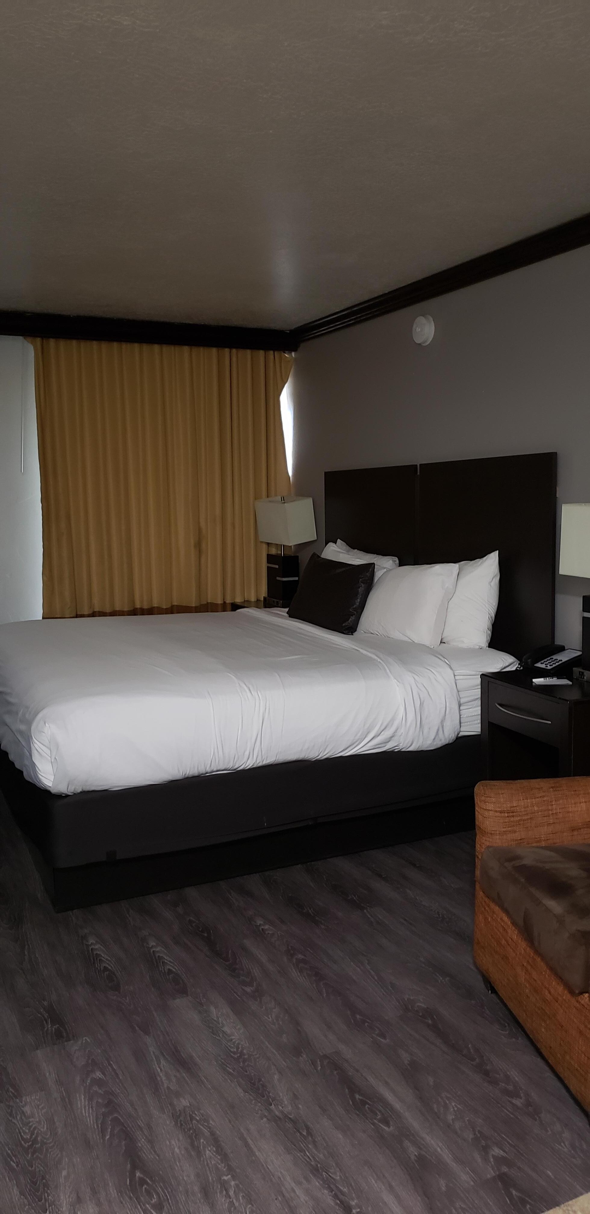 bed. pull curtain back and there is a sliding door to the shared upper floor outside access area