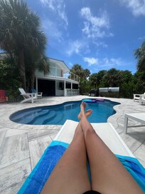 Poolside and view of house.