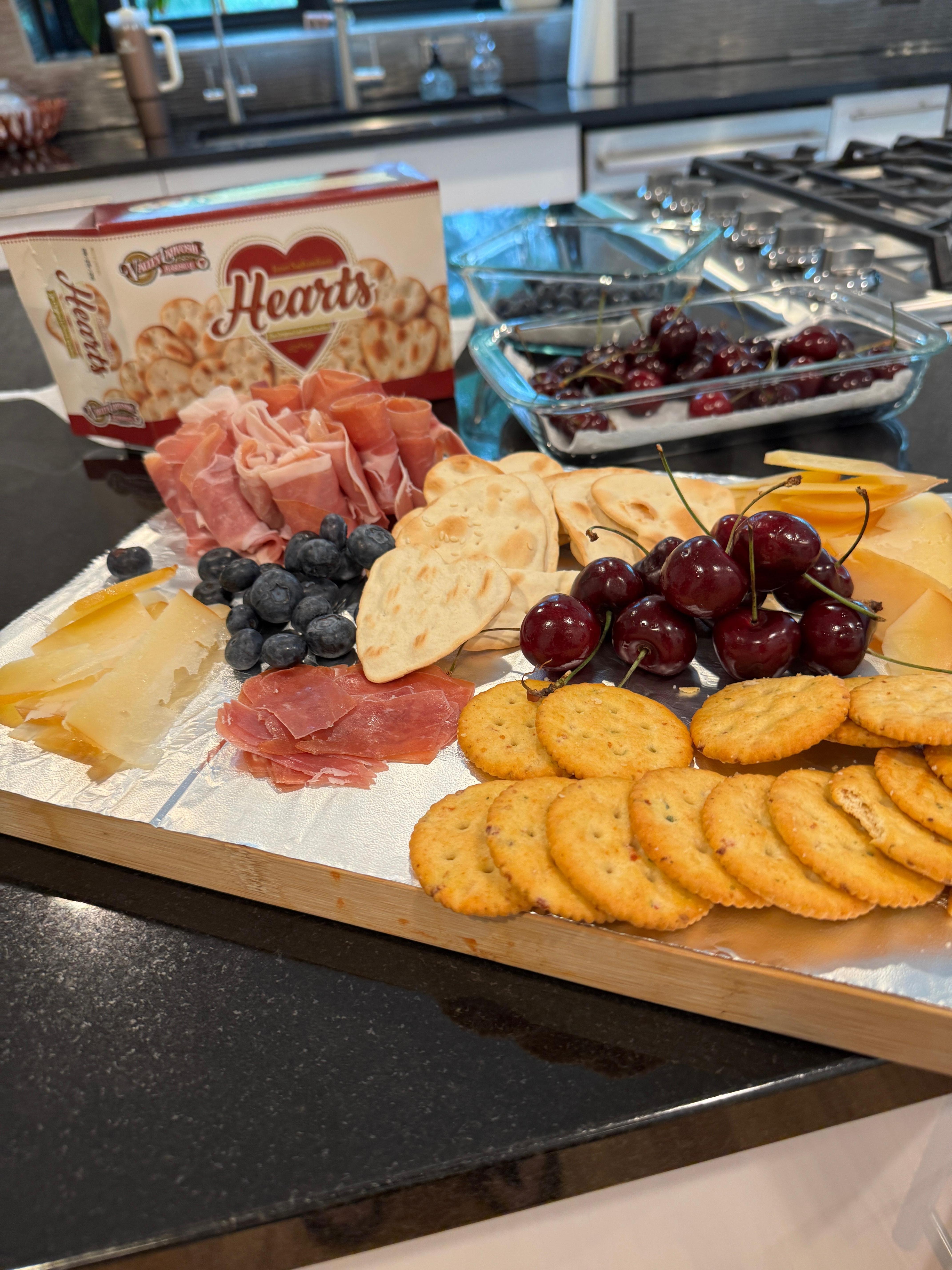 I made us our own Cheese Board - I had the kitchen room to get a little fancy. =}