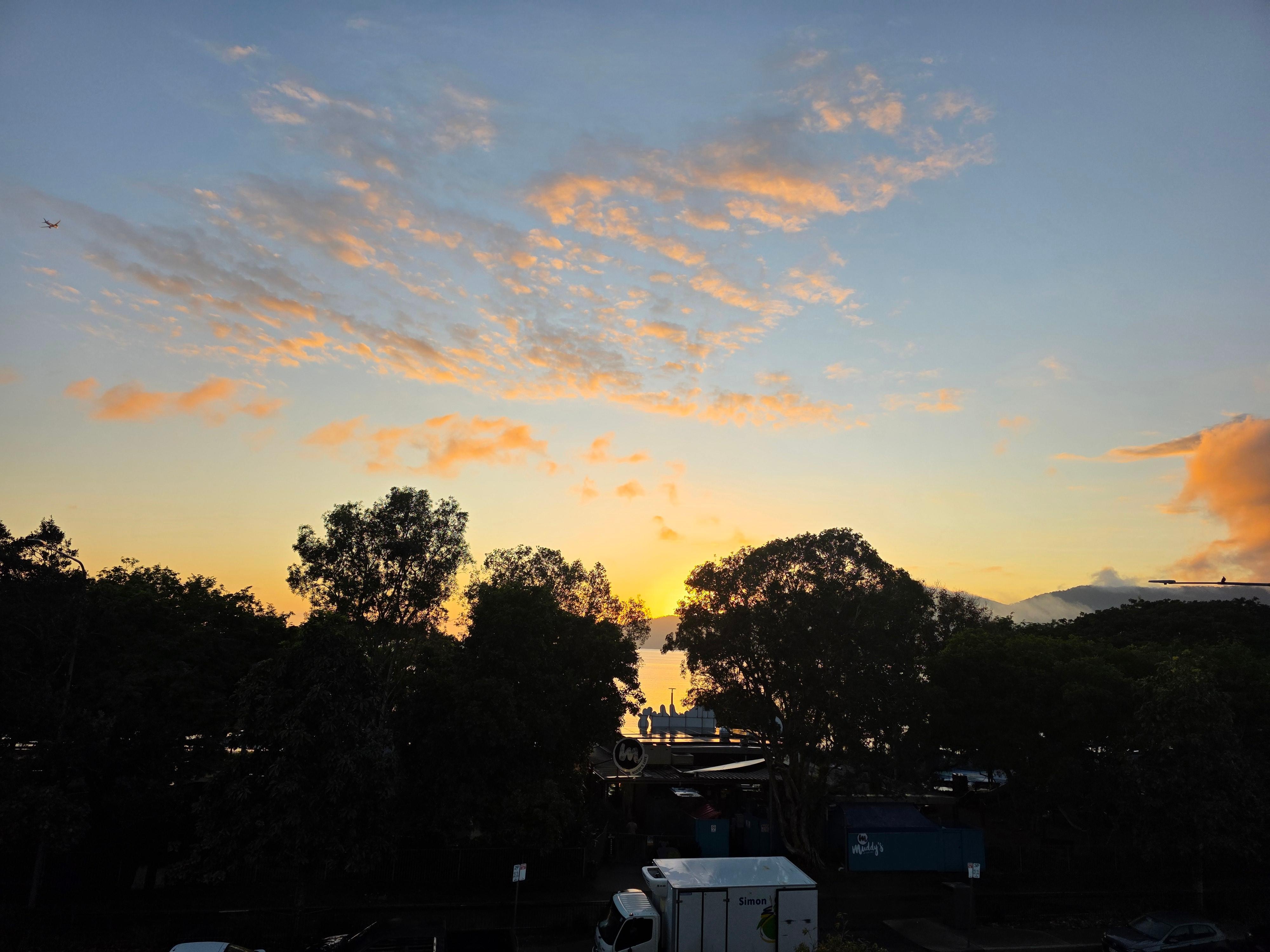 Sunrise from our apartment balcony with a current view of the waterfront.