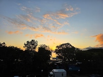 Sunrise from our apartment balcony with a current view of the waterfront.