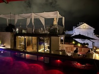 Rooftop bar and pool at night