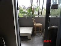 Patio furniture that didn't fit. We moved the chair out there for someplace clean to sit.