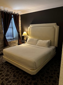Bed tucked round the corner