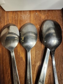 Dirty silverware in drawers.