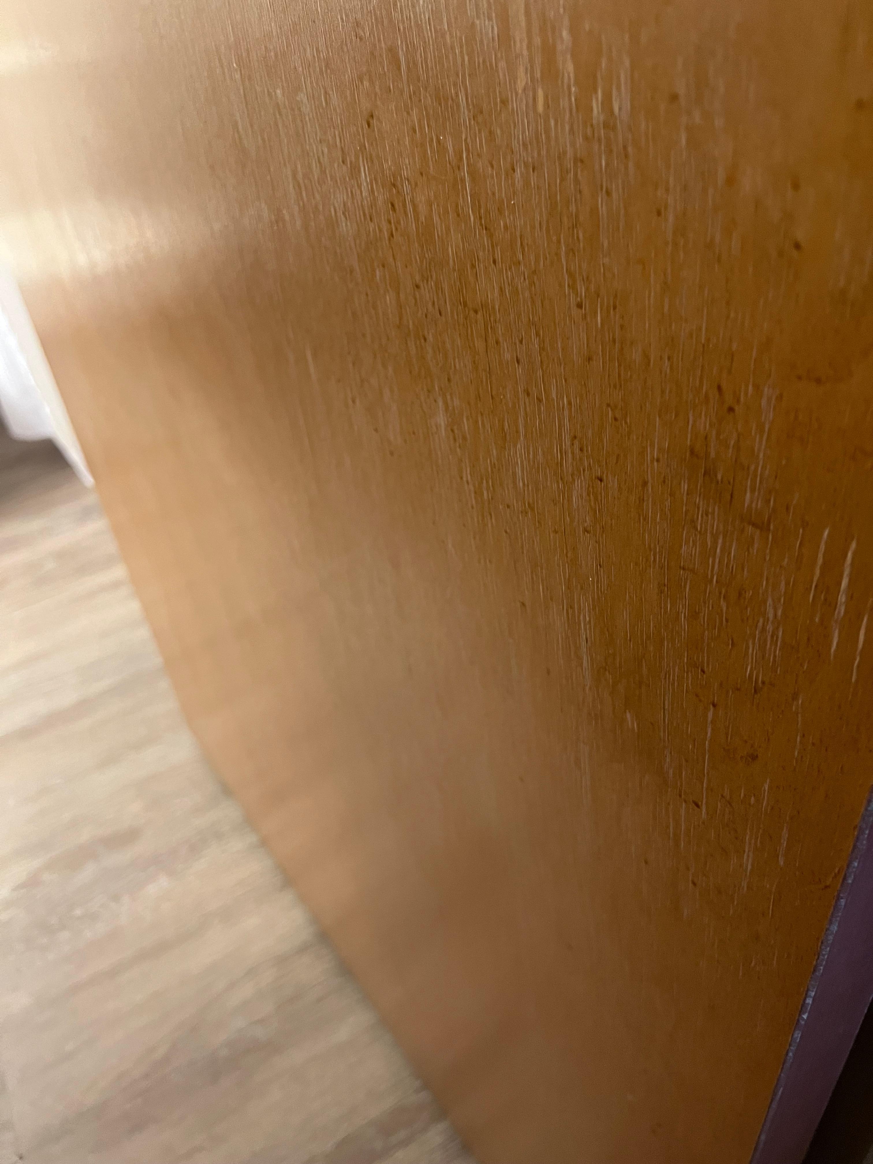 Brown specks all over bathroom door 