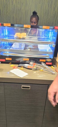 Empty food bins and not cleaned up