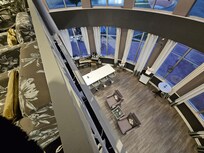 Balcony overlooking bar below and windows facing front of hotel.