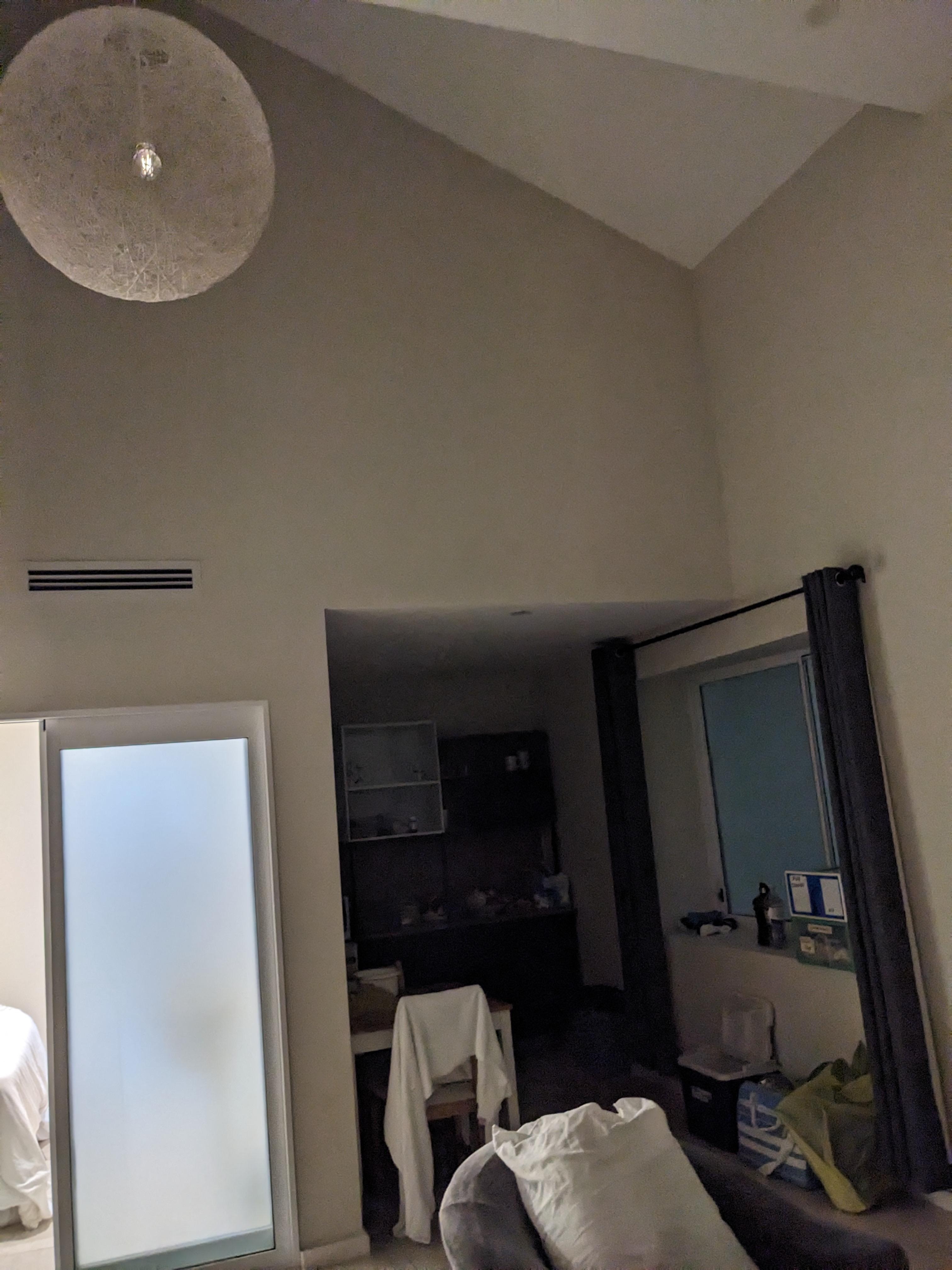 Kitchen at night with no working light and the main light in the living room