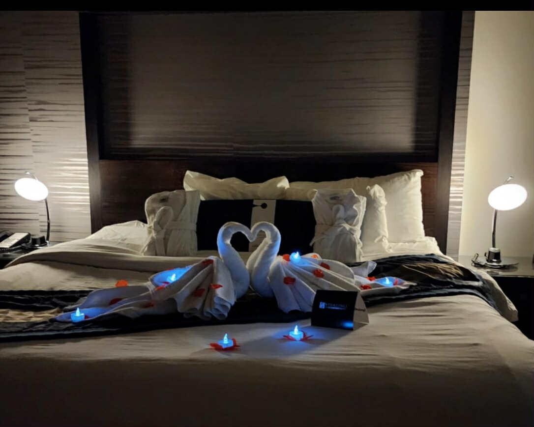 King bed + tea lights and rose amenity add on + they made this wonderful towel decoration 