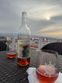 Enjoying a bottle of wine with friends on your beautiful deck before heading to concert