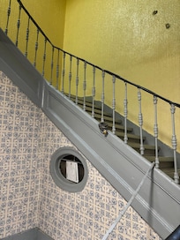 Dilapidated stairs to their entrance.